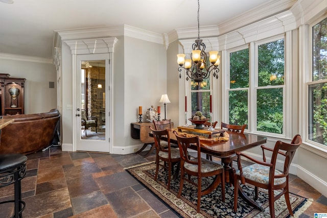 dining area with an inviting chandelier and crown molding