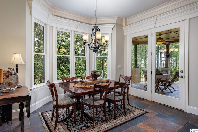 dining room featuring crown molding and an inviting chandelier