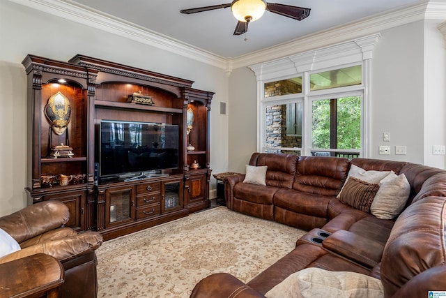 living room with ceiling fan and ornamental molding