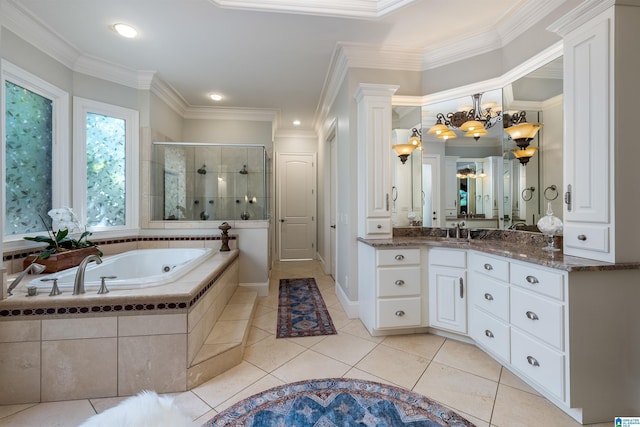 bathroom with tile patterned flooring, shower with separate bathtub, vanity, and crown molding