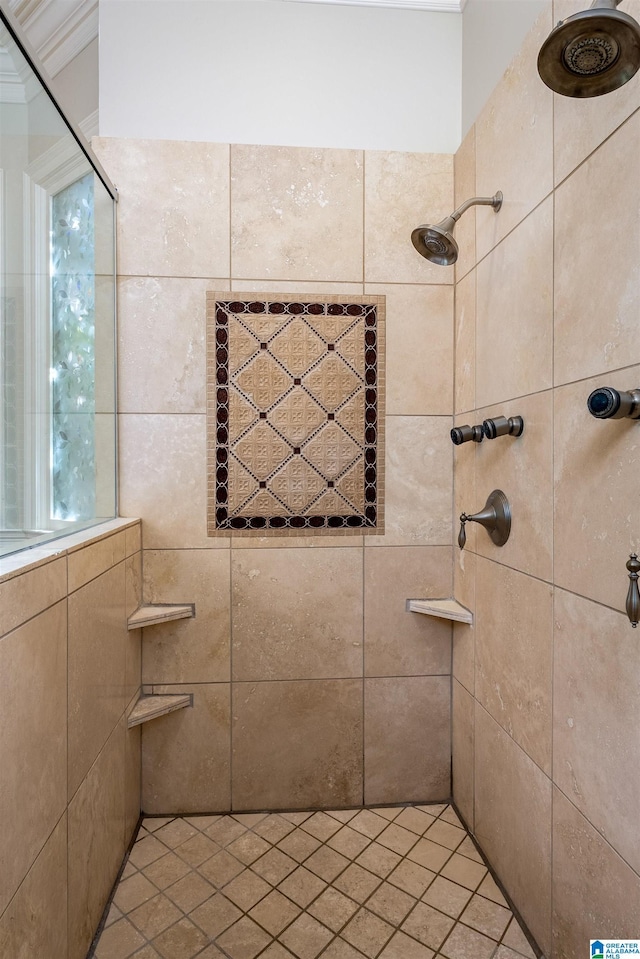 bathroom with crown molding and tiled shower