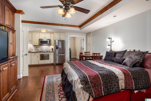 bedroom with ornamental molding, dark hardwood / wood-style floors, stainless steel fridge with ice dispenser, and a tray ceiling