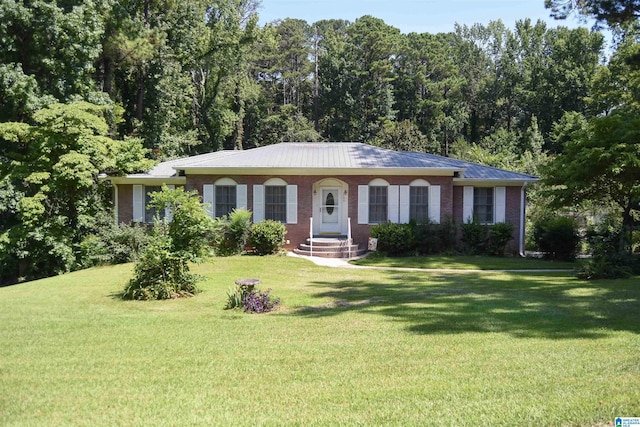 ranch-style home with a front lawn