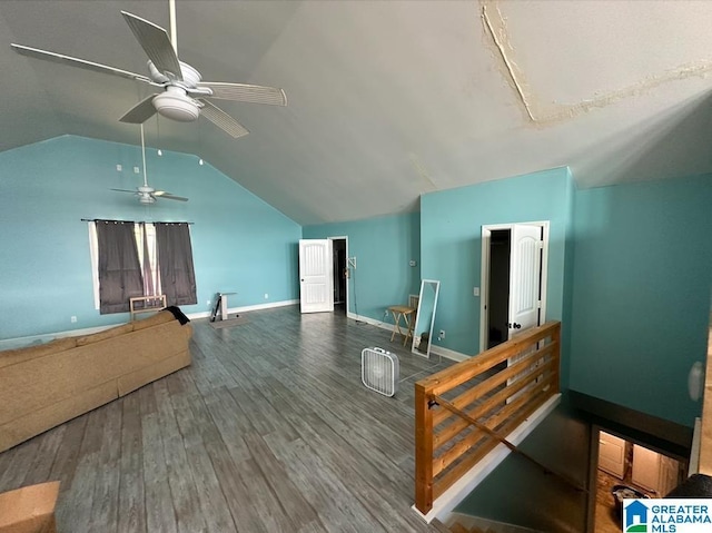 additional living space featuring ceiling fan, wood-type flooring, and vaulted ceiling