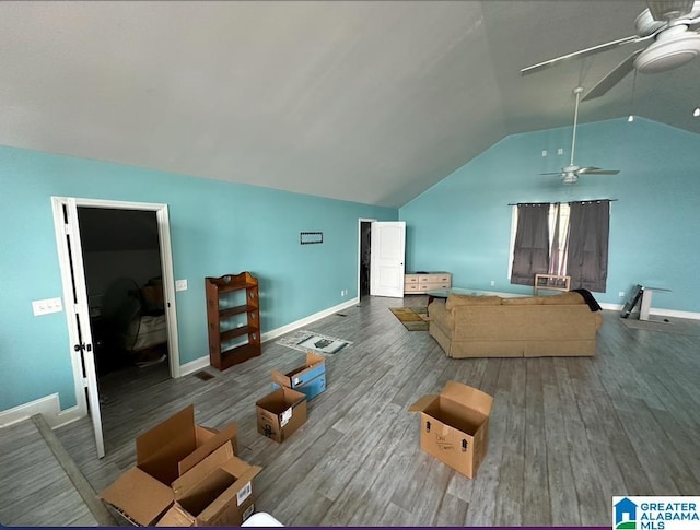 living room with hardwood / wood-style flooring, lofted ceiling, and ceiling fan