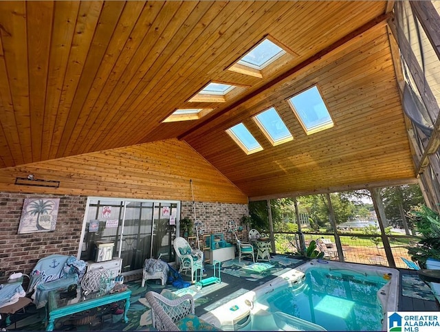 view of pool with a jacuzzi and a skylight