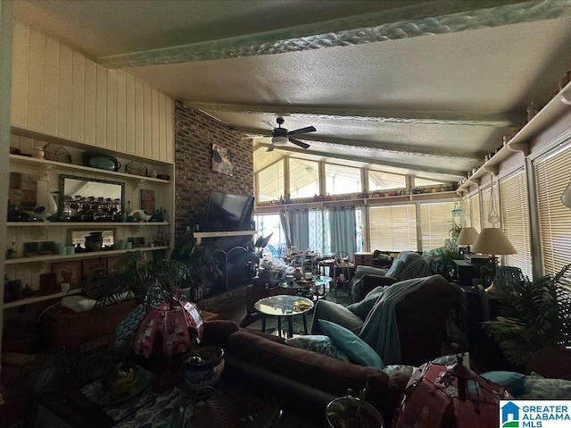 living room with vaulted ceiling with beams, wooden walls, and ceiling fan