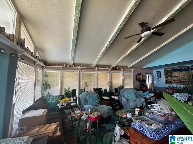 miscellaneous room with ceiling fan and lofted ceiling with beams