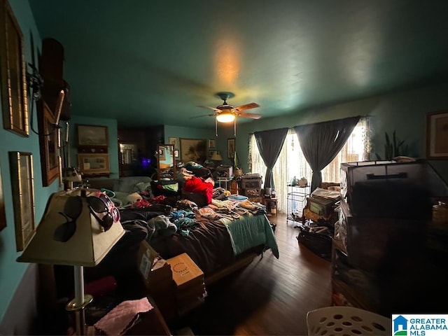 bedroom featuring ceiling fan and wood-type flooring