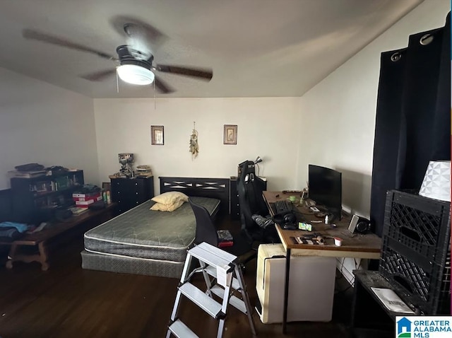 bedroom with ceiling fan and dark hardwood / wood-style floors