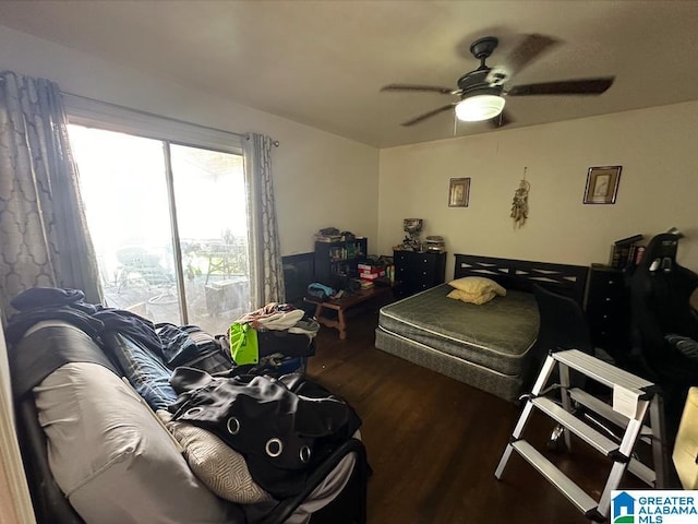 bedroom featuring dark hardwood / wood-style flooring and ceiling fan