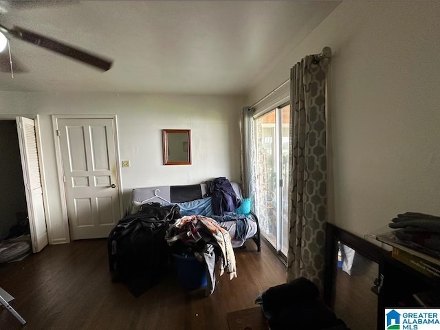 bedroom featuring dark wood-type flooring and ceiling fan