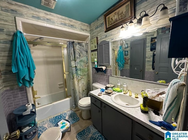 full bathroom with vanity, shower / bath combo with shower curtain, and toilet