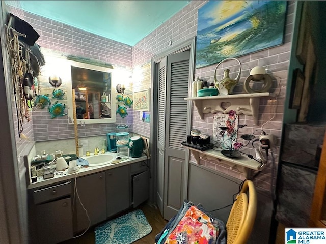 interior space featuring vanity and decorative backsplash