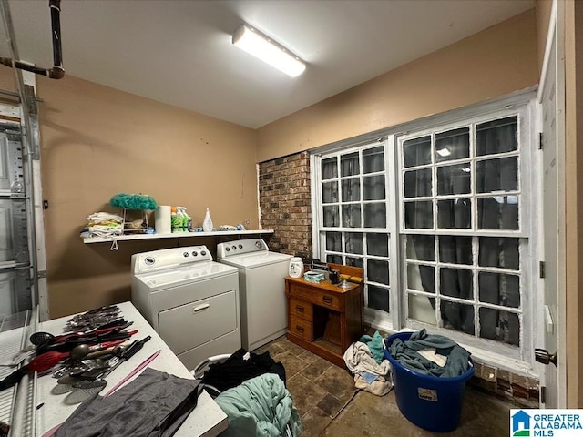 clothes washing area with independent washer and dryer