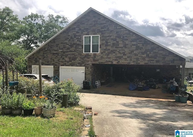 view of side of property featuring a garage