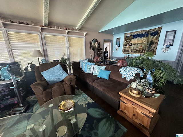 living room with lofted ceiling with beams