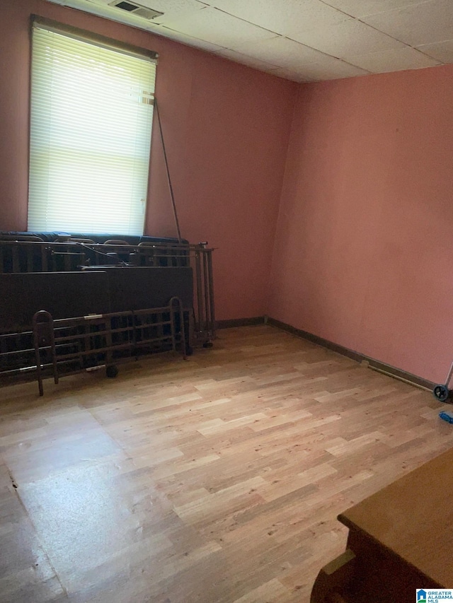 spare room featuring wood finished floors and baseboards