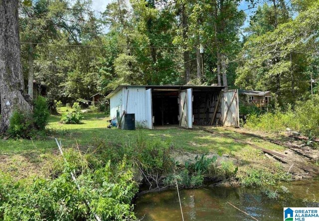 view of outbuilding featuring a water view