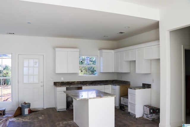 kitchen with white cabinetry and a kitchen island