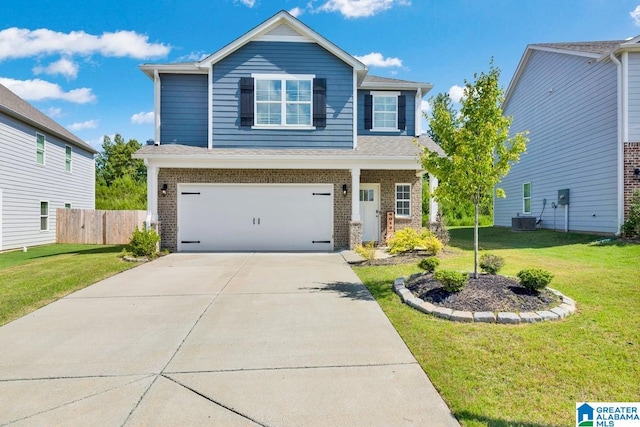 view of front of home with a garage, a front lawn, and central AC unit