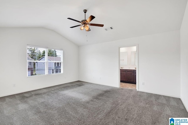 empty room featuring carpet, ceiling fan, and lofted ceiling