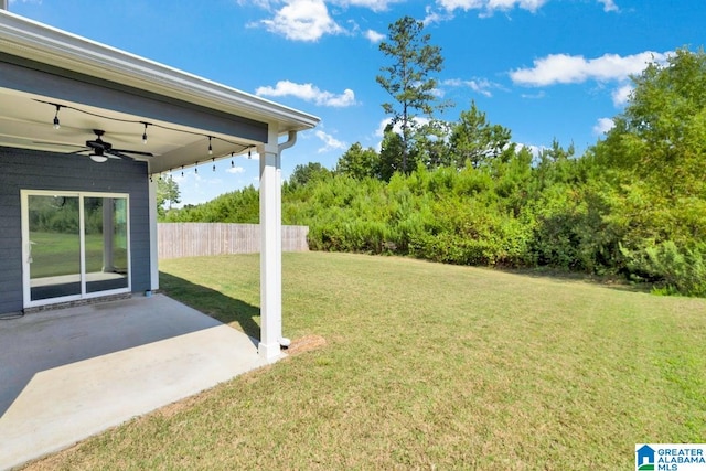 view of yard featuring a patio area and ceiling fan