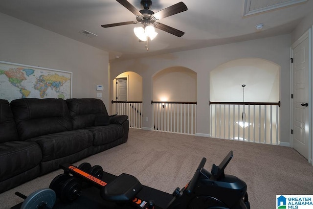 living room with ceiling fan and carpet