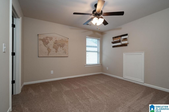 unfurnished room with ceiling fan and carpet flooring