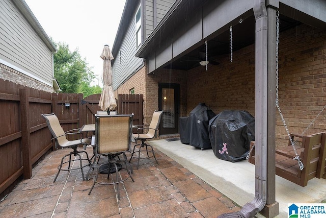 view of patio / terrace featuring ceiling fan and a grill