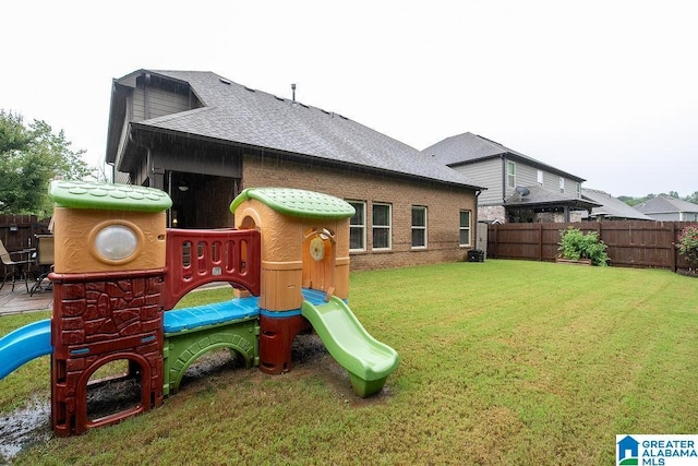 view of jungle gym with a lawn