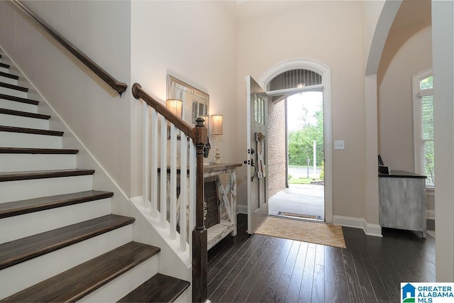 entryway with dark wood-type flooring