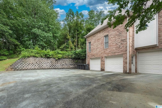 view of side of home with a garage