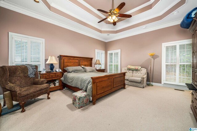 carpeted bedroom featuring crown molding and connected bathroom