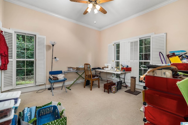 carpeted office space with baseboards, ornamental molding, and a ceiling fan