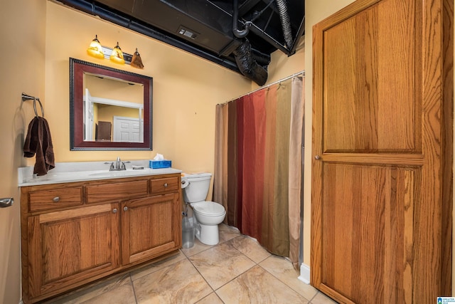 full bathroom with a shower with curtain, vanity, and toilet