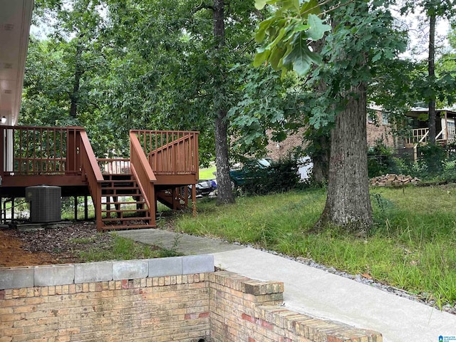 view of yard featuring a deck and cooling unit