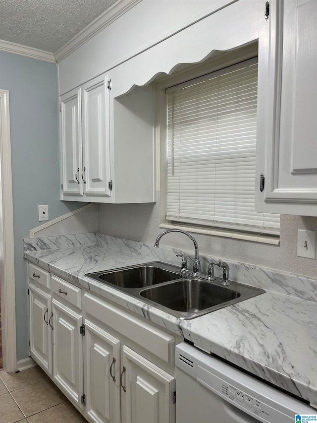 kitchen with dishwasher, sink, light tile patterned flooring, white cabinetry, and ornamental molding