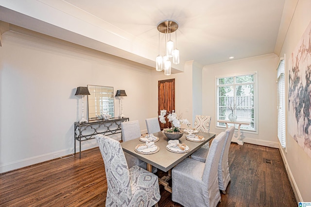 dining room with a notable chandelier, baseboards, dark wood-type flooring, visible vents, and ornamental molding