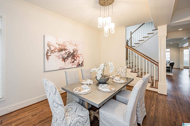 dining area featuring crown molding, baseboards, wood finished floors, and stairway