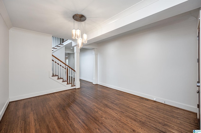 interior space featuring a chandelier, stairs, baseboards, wood finished floors, and visible vents