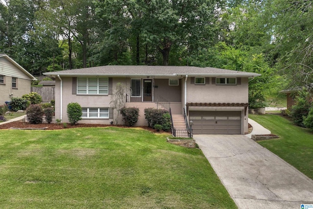 view of front facade with a garage and a front lawn