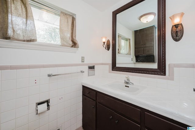 bathroom featuring tile walls, backsplash, and vanity