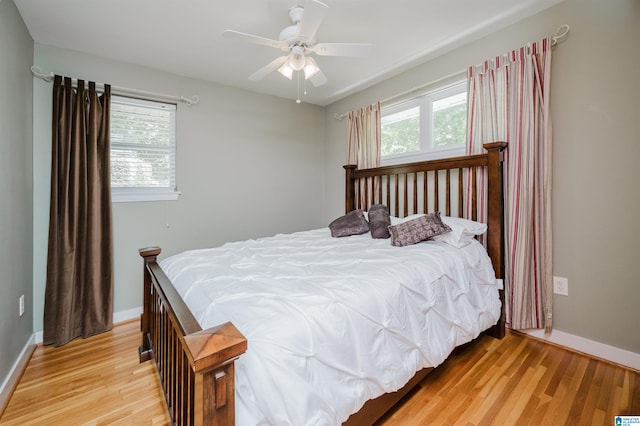 bedroom with ceiling fan and light hardwood / wood-style floors