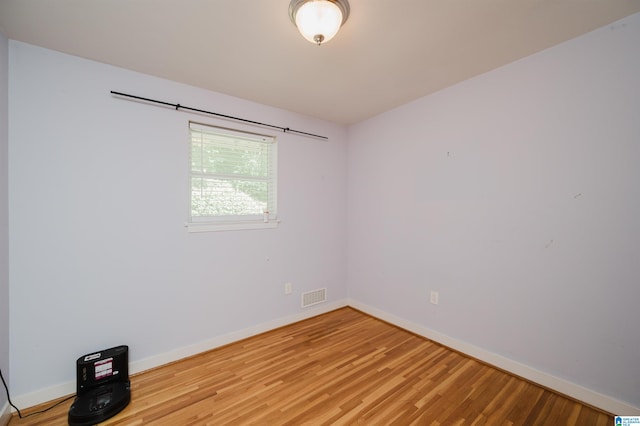 unfurnished room with light hardwood / wood-style floors