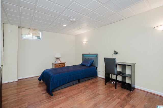 bedroom with hardwood / wood-style floors