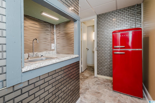 bathroom with vanity, a paneled ceiling, and tile patterned floors