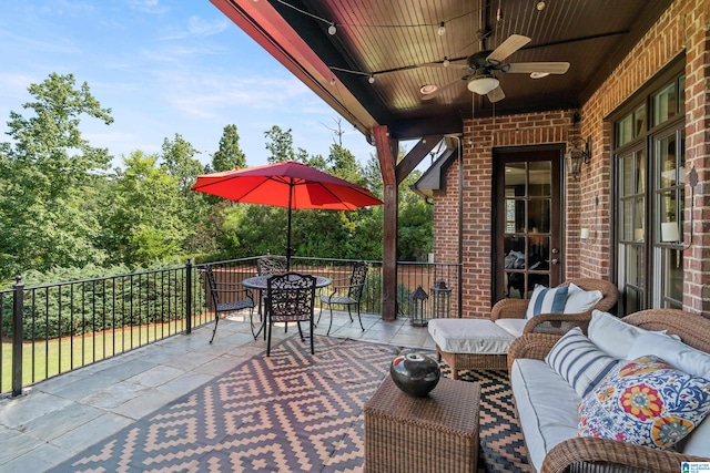 view of patio / terrace featuring a balcony, ceiling fan, and outdoor lounge area