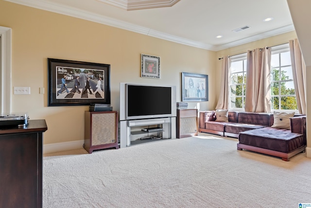 living room featuring ornamental molding and carpet flooring