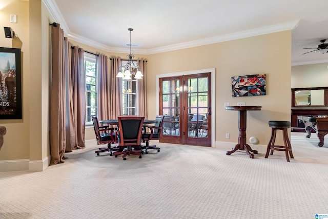 carpeted dining room featuring crown molding, ceiling fan with notable chandelier, french doors, and plenty of natural light